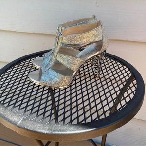 Michael Kors silver heels.